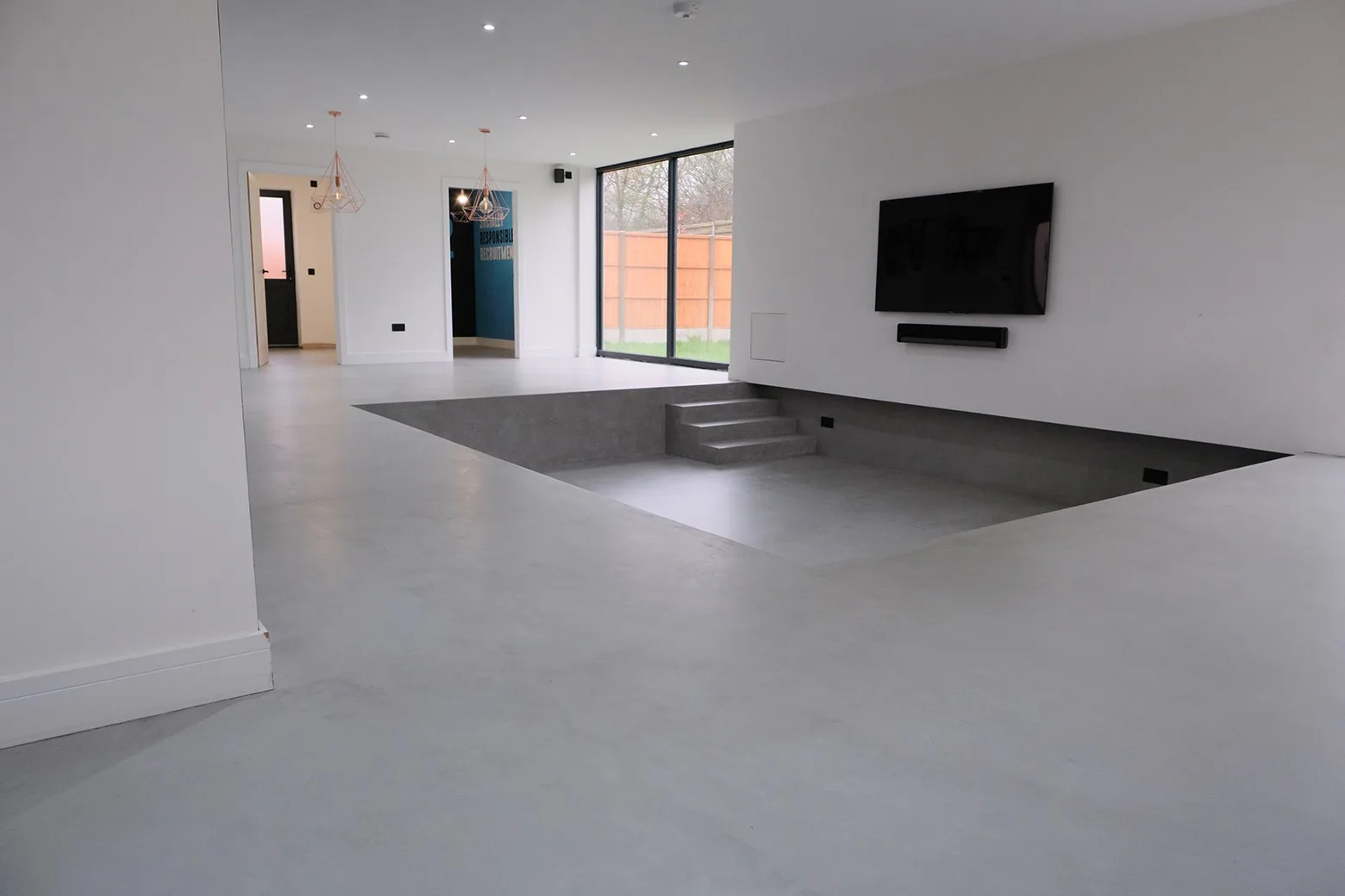 Finished microcement floor in an open-plan room