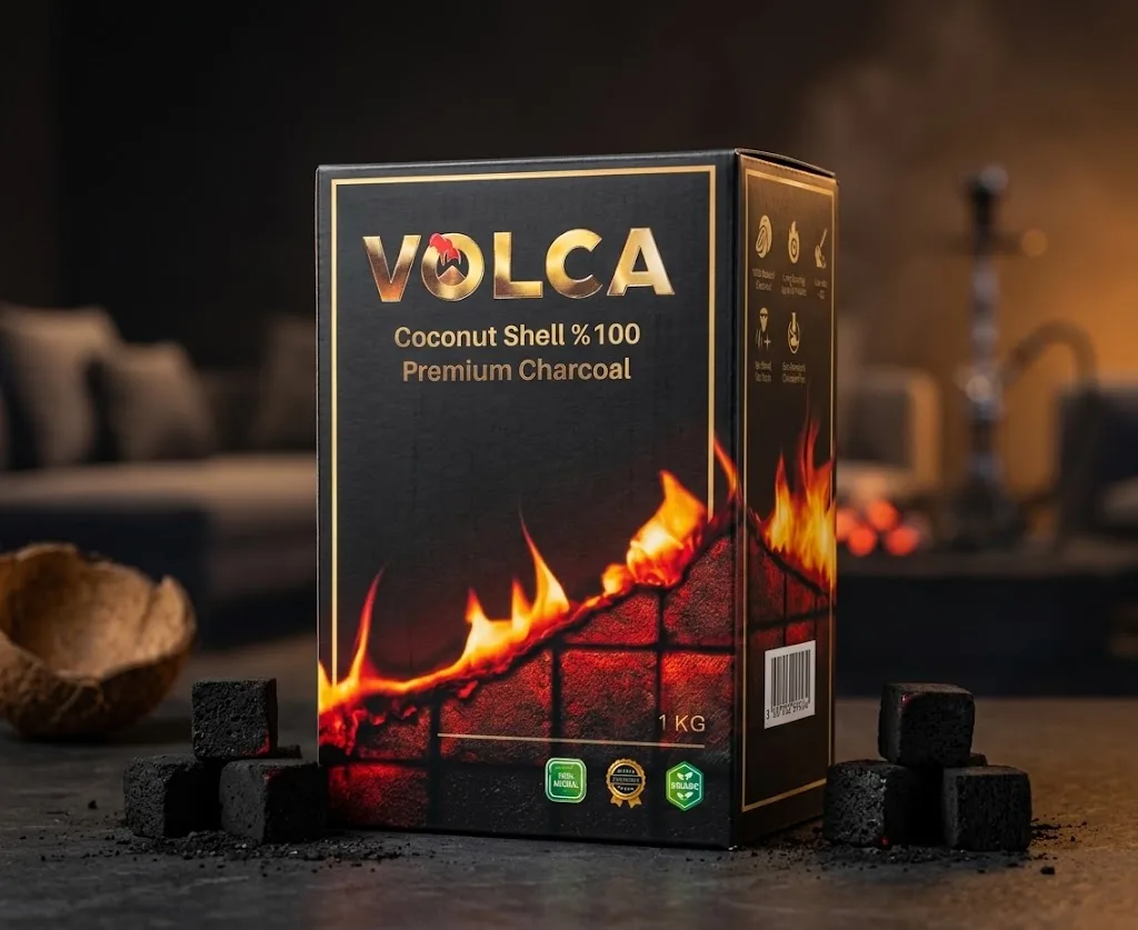 Volca 1 kg charcoal box on a dark table beside coconut-shell charcoal cubes, with a shisha in the background